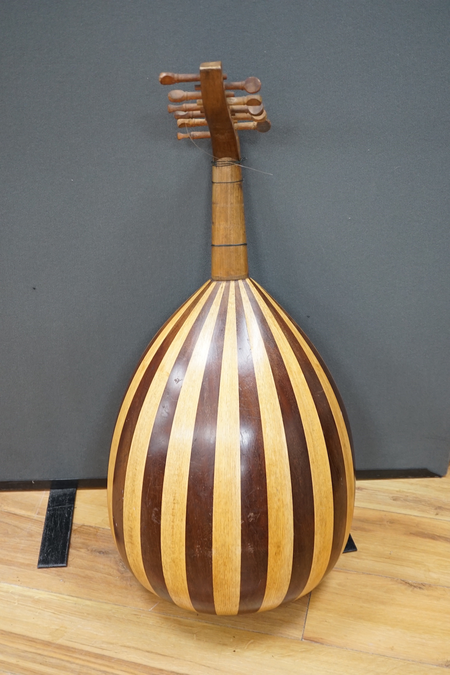 A Middle Eastern eleven string lute, overall length 82cm